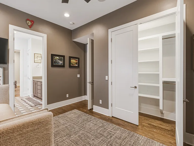 Bedroom #3 features a cozy trundle bed with attached closet, smart TV and convenient Jack-and-Jill bathroom_offering both privacy and easy access for guests.