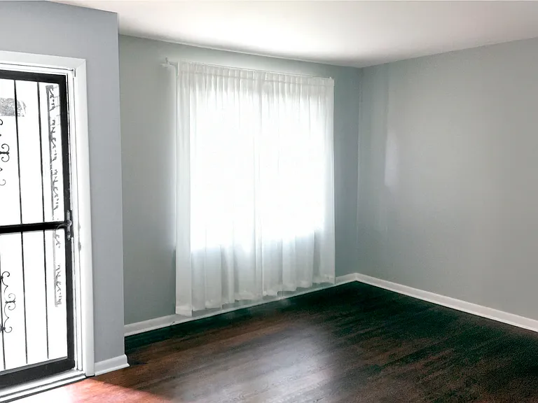 Main floor living room with large window.