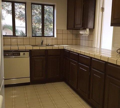 spacious kitchen with refrigerator