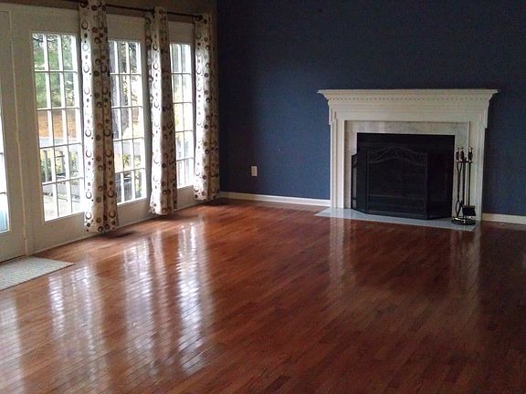 Family room with fireplace and lots of natural light.