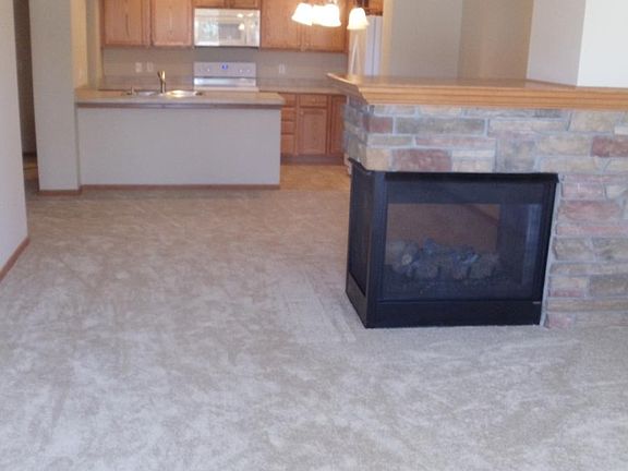 Open Concept Living and Dining Room with Gas Fireplace