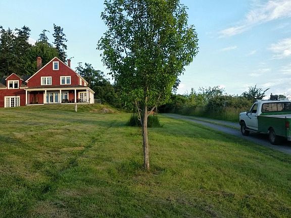 Red house with fruit trees: pears, apples, cherries