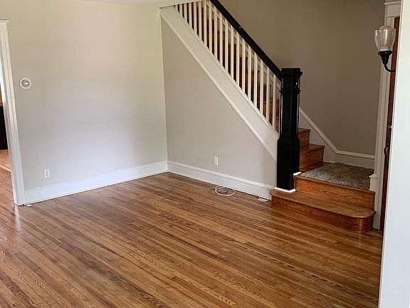 Living room w/ stairs