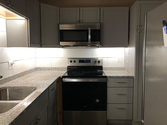 Kitchen with all new stainless appliances, undercabinet lighting, new cabinets, new backslash and new granite countertops approximately 110 SF