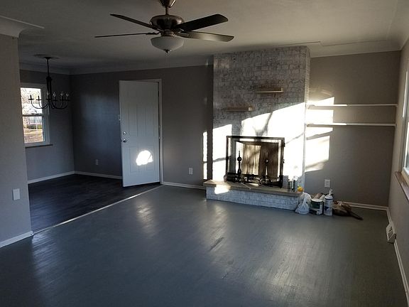 Living room with fireplace. Dining room area