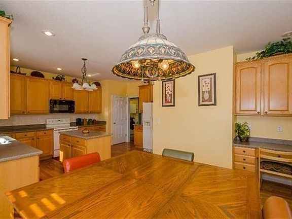 Kitchen with hardwood floors, planning desk, all appliances stay 1st floor laundry off kitchen