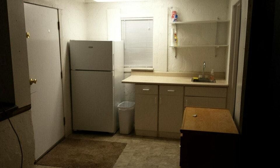 Kitchen area. Bathroom is through a door on the right