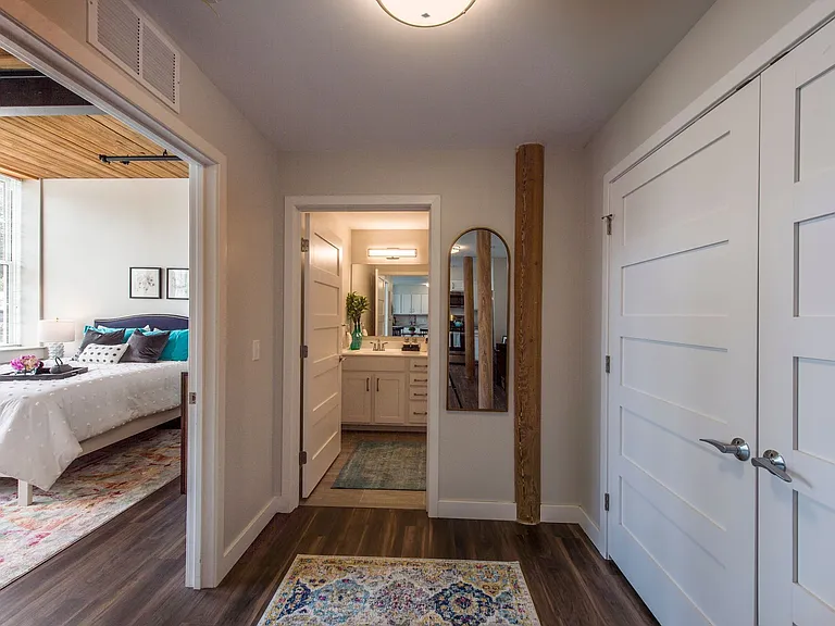 View Of Hall To Bedroom And Bath. Two Tone Paint, Modern 6 Panel Doors, Wood Plank Floors.