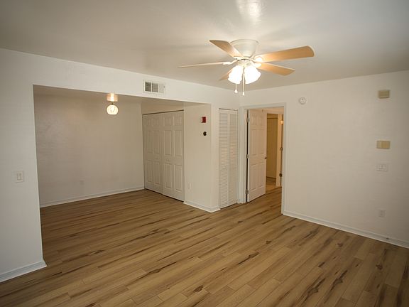 Living room and dining area. Closet contains washer and dryer.