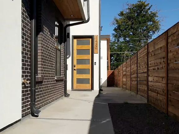 Front door. Walkway leads to the back alley.