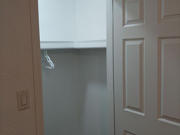 Walk-in closet in secondary bedroom