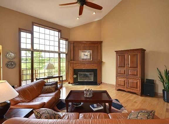 Great Room with vaulted ceiling & gas fireplace