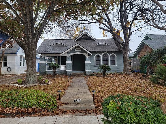 Front view of house with driveway on the left.