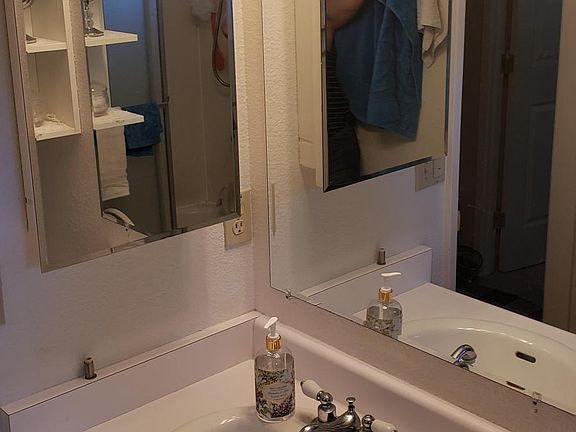 Upstairs full bath sink, with plenty of vertical storage/cabinets