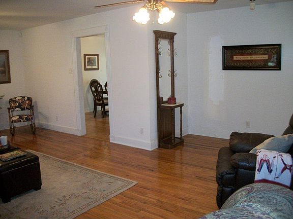 Living area leading into dining and kitchen areas