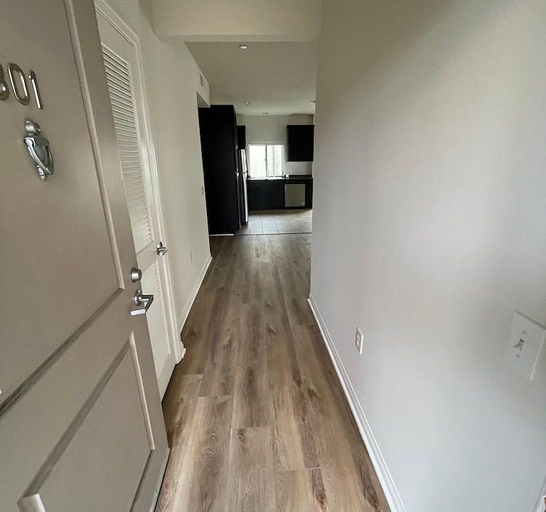 Entry hall with laundry closet and storage closet.