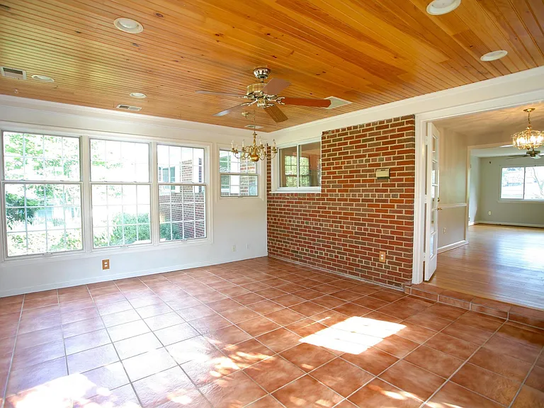 Stunning sun room with tile flooring