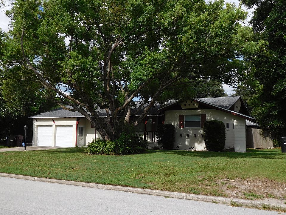 Street view of house, driveway and double garage