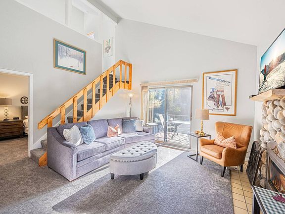 Front room with TV & fireplace. Also sliding glass door to the private patio.