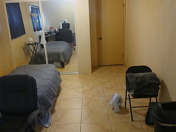 Closet doors have mirrors, door on right is into the main part of house.