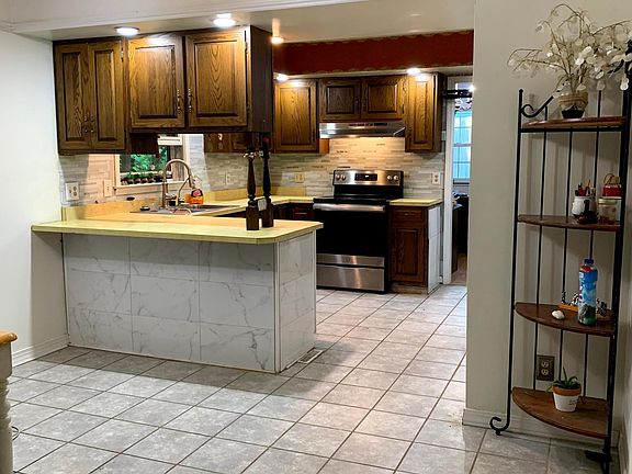 Kitchen with all stainless steel appliances installed 2021