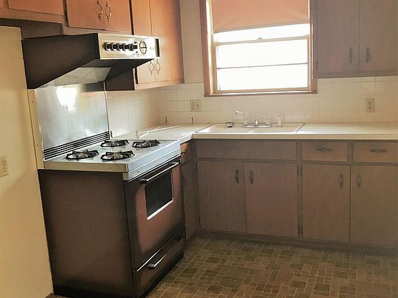 Kitchen with stove, and fridge (not pictured)