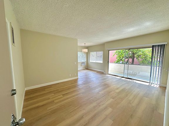 Upper front unit. Large living room with 13 foot slider to patio