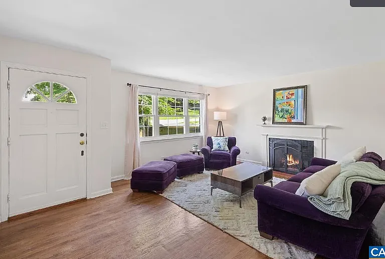 front entry living room with fireplace