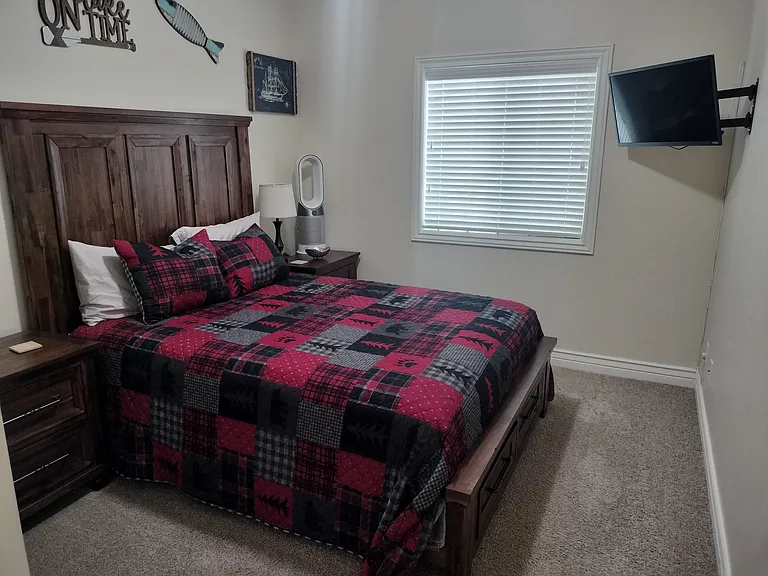 Two inviting guest bedrooms feature Smart TVs and convenient touch lighting, offering comfort and modern amenities for a relaxing stay. Perfect for unwinding and enjoying a restful night.