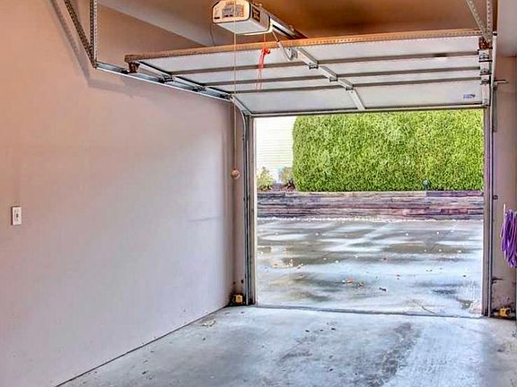 Single car garage with storage space.