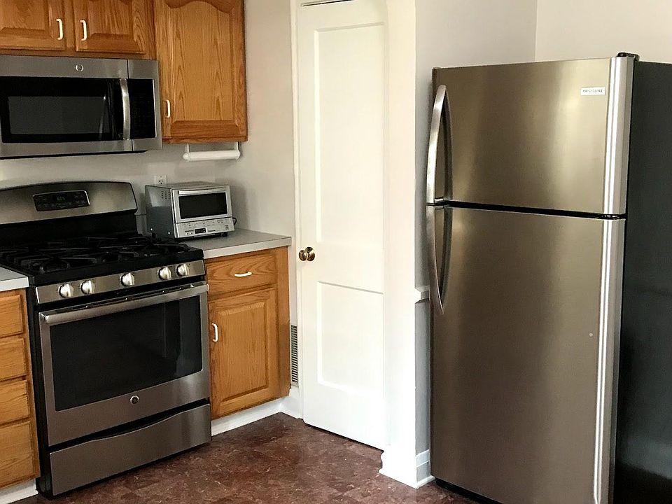 Kitchen, door to pantry left of refrigerator.