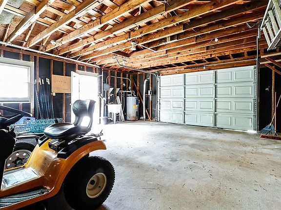 Oversized Detached Garage has room for vehicles but would be perfect for a workshop or for additional storage space.