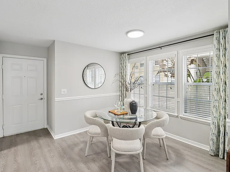 Bright dining space with elegant seating and natural light