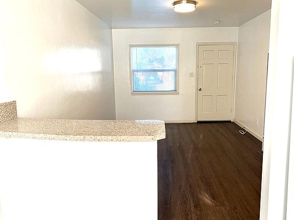Living room connects with kitchen and breakfast bar area.