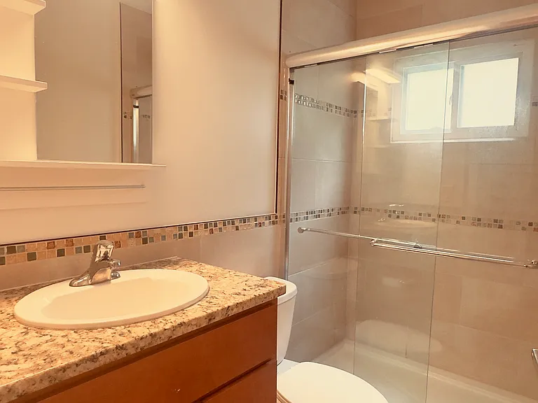 Modern First-Floor Bathroom Featuring a Walk-In Shower