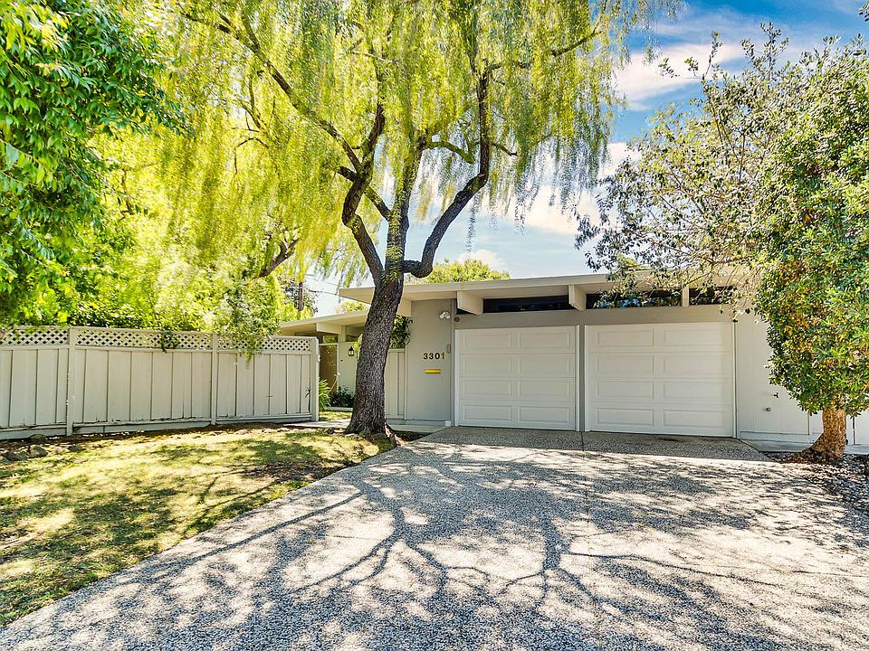 This charming home is nested within a cul-del-sac surrounded by lush landscaping.