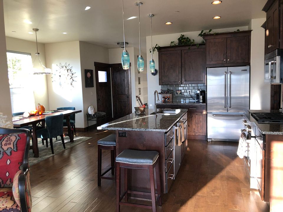 open concept with kitchen, living room, and dining room