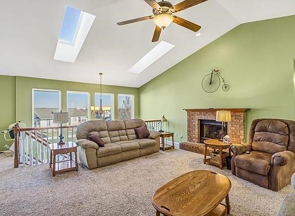 Living area with plenty of natural light from the atrium windows and sky lights.