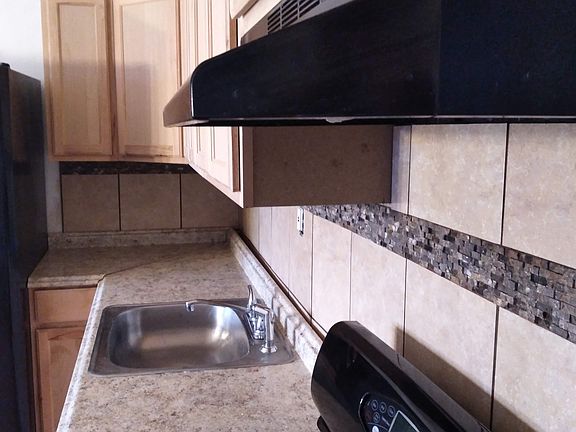 Tile and accent tile compliment the newly renovated bathroom.