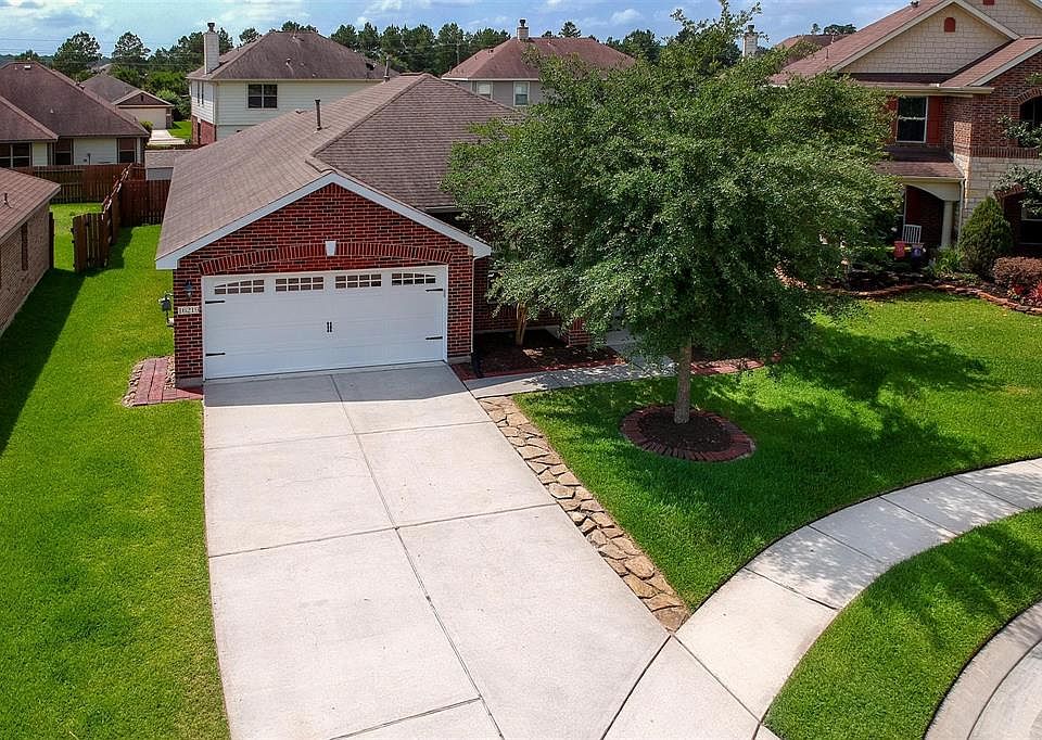 Welcome home! 16219 Range Valley. Recent upgraded garage door, mature landscaping, and extended drive way.