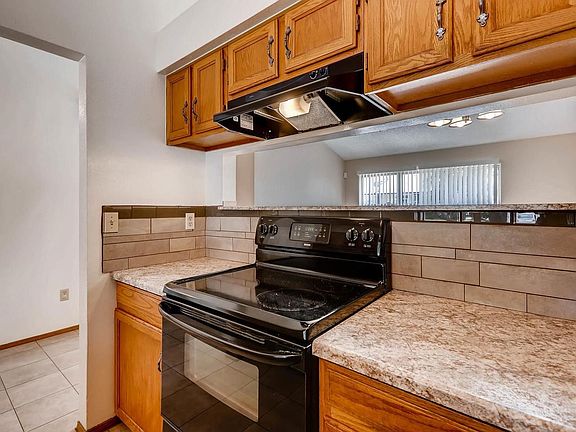 New hood, counters, and decorative tile. Open to great room.