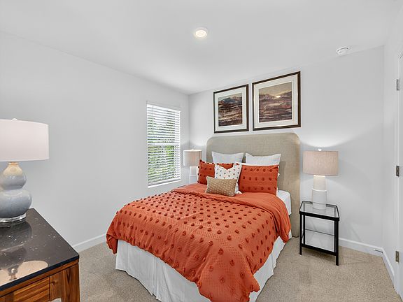 The Dakota floorplan includes three secondary bedrooms.