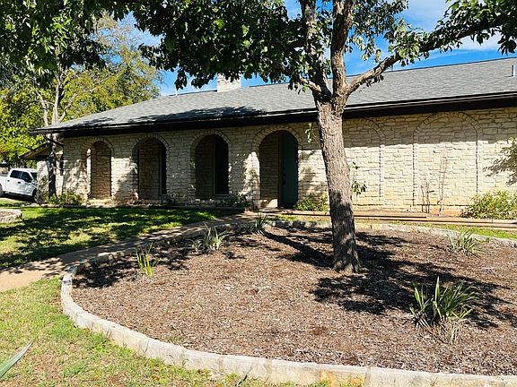 Corner house with attached 2 car garage.