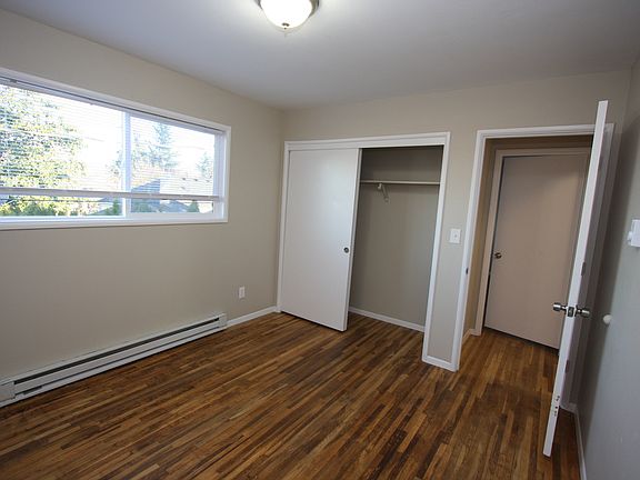 Bedroom with closet and large window
