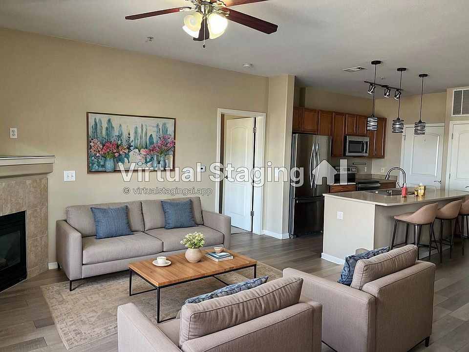 LIving/Main room - staged to show size. Slider patio door with Juliann balcony behind photographer