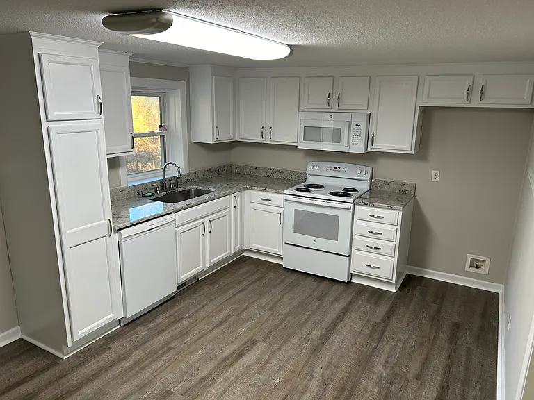 Bright kitchen with lighting under the cabinets.