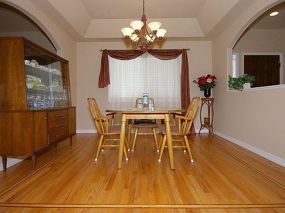 Formal dining room with in laid hardwood flooring