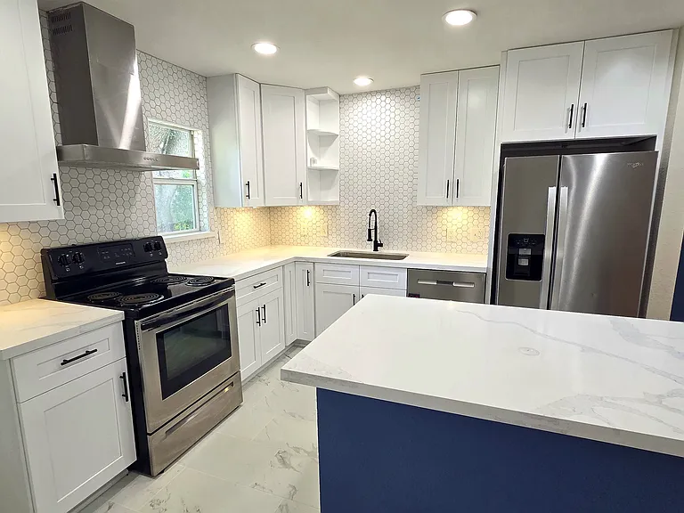 Bright and beautiful. Offers lot of storage recessed lighting, stainless steel appliances and sleek white quartz.