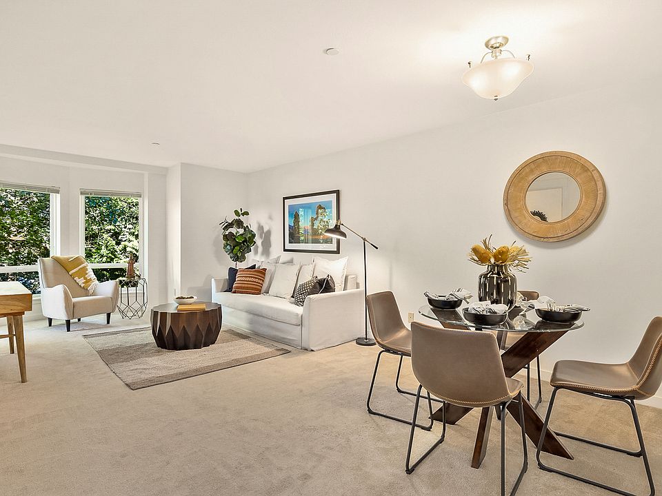 The open floor plan is spacious with large bay window.