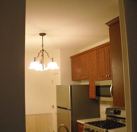 This is a shot taken from just off the living room looking into the eat-in-kitchen. It's nicely-framed and adds a little architectural drama to the area.
